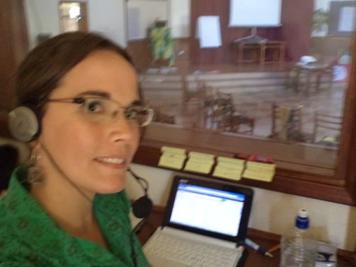 Helena Wergles working professionally as a simultaneous interpreter in Kenya for a catholic congregation of religious women.