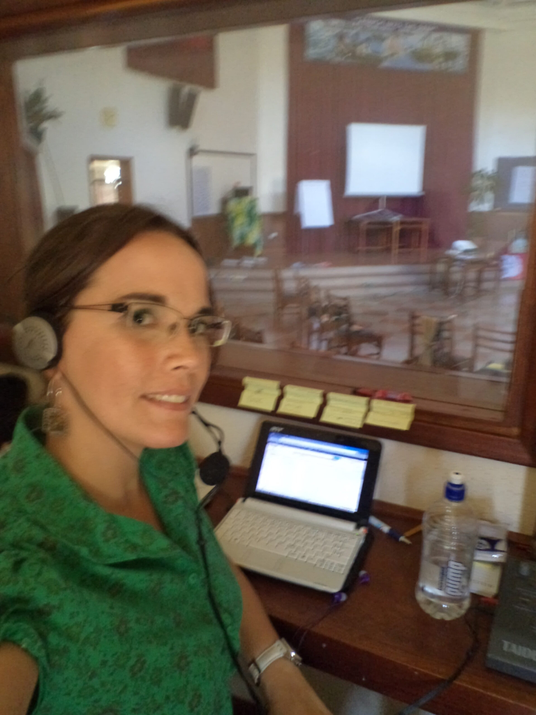 Helena Wergles working professionally as a simultaneous interpreter in Kenya for a catholic congregation of religious women.